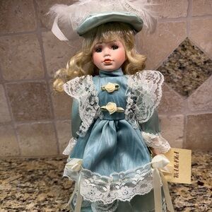 Elegant light green Porcelain Doll with Lace Detailing